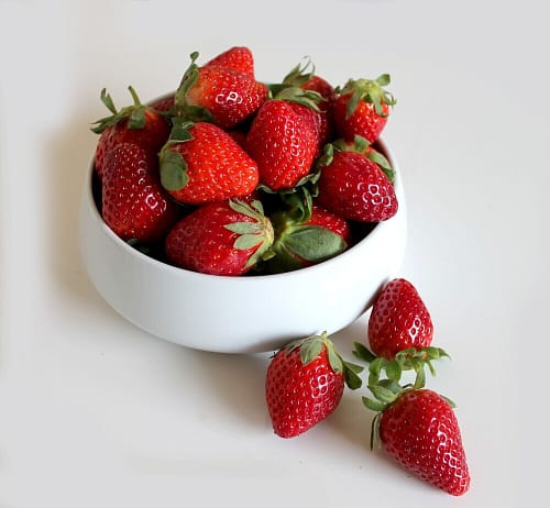 10 Reasons Why Prevention Is Better Than Cure. 4 Qhite bowl filled with fresh strawberries