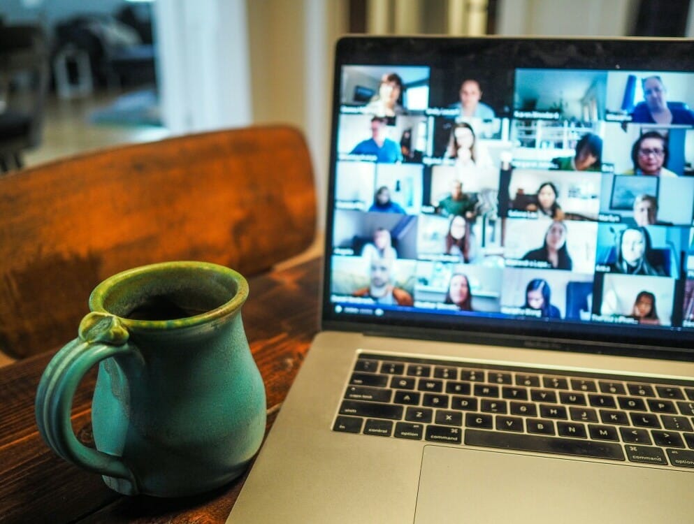 a laptop with a mug on the screen